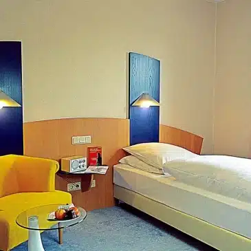 Großes Hotelzimmer mit Kingsize-Bett modern im Retro Hotel Lünen